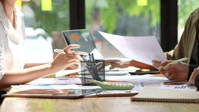 Collaborative workspace showcasing teamwork and productivity, with hands engaged in discussion over documents and tools on table, enhancing office collaboration and effective meetings. - Powered by Shutterstock - Get 15% off with code: PIKWIZARD15