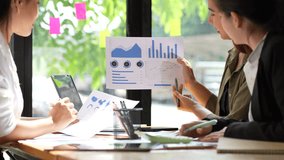 Business Professionals Collaborating on Data Analysis Teamwork in Action with Charts and Graphs for Strategic Decision Making - Powered by Shutterstock - Get 15% off with code: PIKWIZARD15