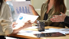 Business Professionals Collaborating on Strategy Analyzing Charts and Graphs in Productive Teamwork Meeting for Effective Analysis and Collaboration - Powered by Shutterstock - Get 15% off with code: PIKWIZARD15