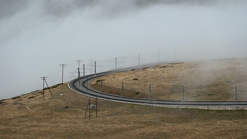 Zermatt Switzerland mountain and moving cloud mist at Riffelboden and Gornergrat bahn train