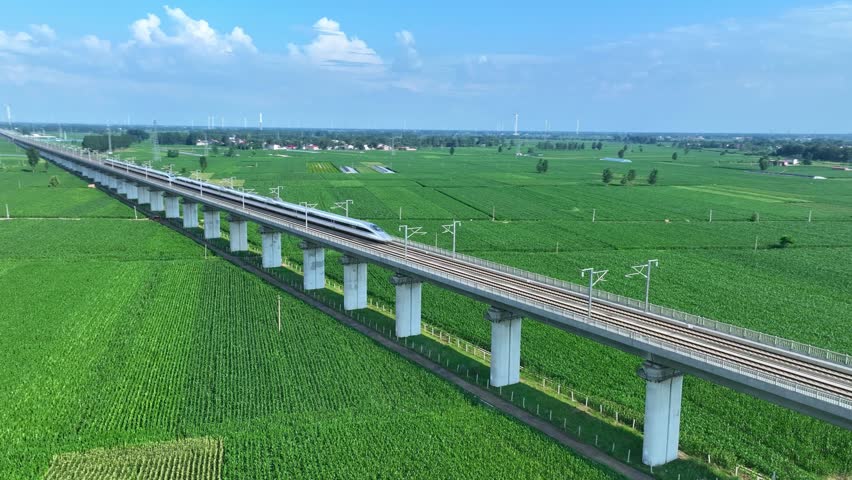 China's high-speed trains running fast on the plains