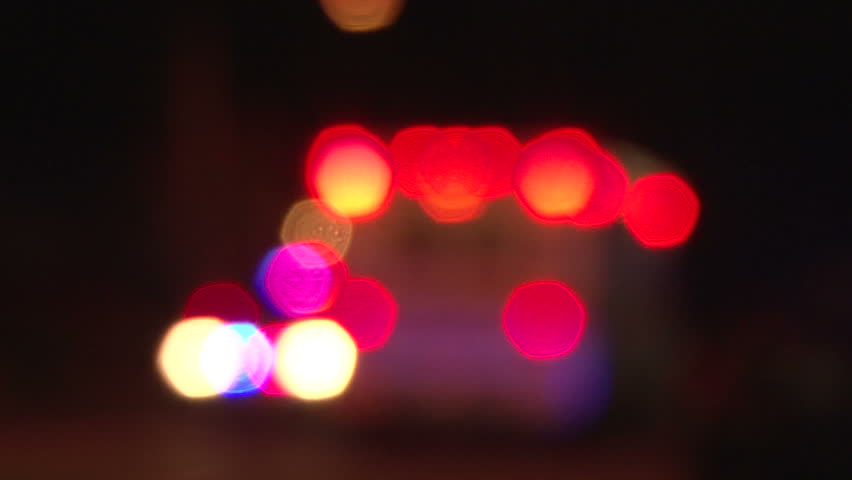 PORTLAND OREGON, CIRCA 2013: Police lights flashing from ambulance as it drives