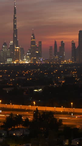 The stunning Dubai Skyline is beautifully lit at dusk, highlighted by the Burj Khalifa