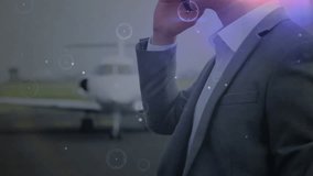 Animation of network of connections over caucasian businessman using smartphon by plane. Global travel, finance, business, connections, computing and data processing concept digitally generated video. - Powered by Shutterstock - Get 15% off with code: PIKWIZARD15