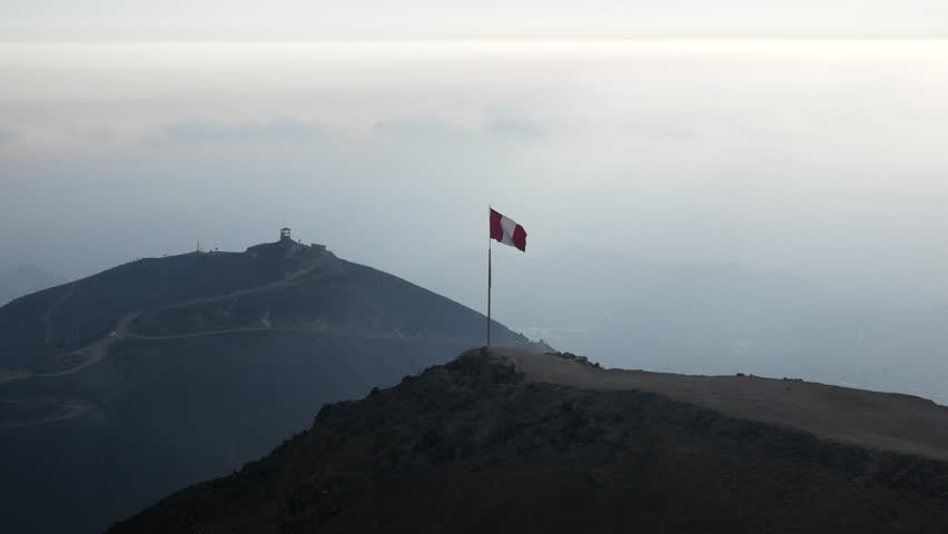 A Viewpoint Known as “Apu Siqay” in Villa del Triunfo, Lima, with a Brand New Peruvian Flag on a Clear Day with Lots of Sunshine