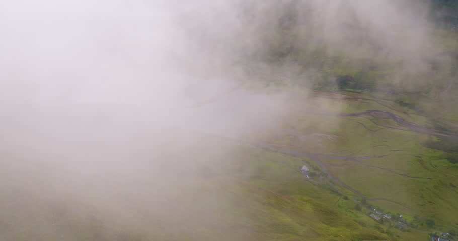 Drone flies through the cloud to reveal epic green landscape near the famous Loch Duich