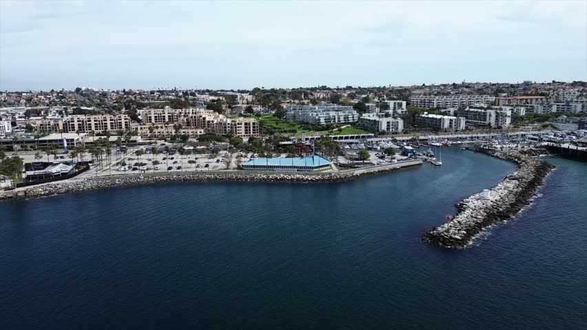 Aerial of Waves on King Harbor's Breakwater and Jetty in Redondo Beach, California