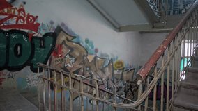 Stairwell in an underpass in a disadvantaged neighbourhood with lots of graffiti on the walls  - Powered by Shutterstock - Get 15% off with code: PIKWIZARD15