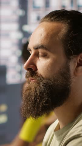 Vertical video Pensive employee using computer to analyze datasets, focused on comparing datasets and checking accounting figures. Close up of man concentrating on solving tasks for team project