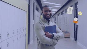 Animation of school icons over smiling african american male teacher in school corridor. Global education, school, connections, computing and data processing concept digitally generated video. - Powered by Shutterstock - Get 15% off with code: PIKWIZARD15