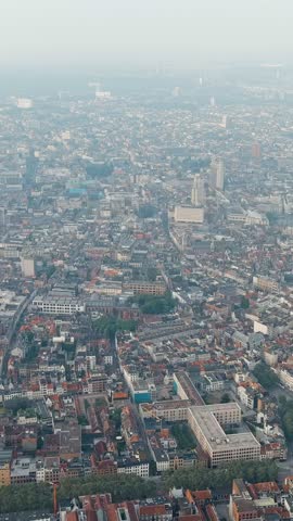 Vertical video. Antwerp, Belgium. Panorama overlooking the Cathedral of Our Lady (Antwerp). Historical center of Antwerp. City is located on the river Scheldt (Escaut). Summer morning, Aerial View