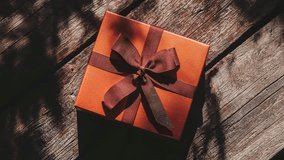 Elegant Gift Box with Ribbon On Rustic Wooden Table - Powered by Shutterstock - Get 15% off with code: PIKWIZARD15