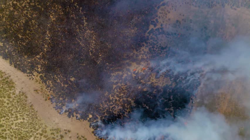 Burning Grass in Large Field
