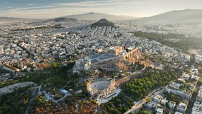 Aerial view of Athens, Greece at sunrise, showcasing Acropolis and surrounding city. Ancient ruins are bathed in golden light. Fly over Parthenon in Athens in the morning, Ancient Greece landmark - Powered by Shutterstock - Get 15% off with code: PIKWIZARD15