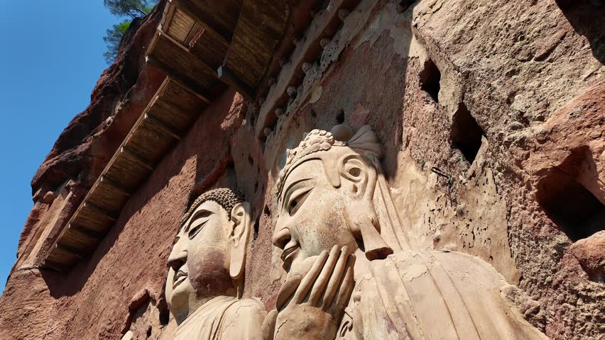 Tianshui, China: Tilt down footage of the famous Maijishan grottoes and its buddhist statues in Gansu province in China. It was an important stop on the silk road. 
