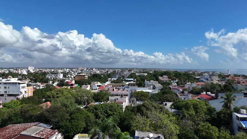 City Of Puducherry With buldings and greenery Clouds And Ocean Drone Shot