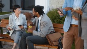 Multiracial business group people, colleagues eating and talking outside of the office during lunch break - Powered by Shutterstock - Get 15% off with code: PIKWIZARD15