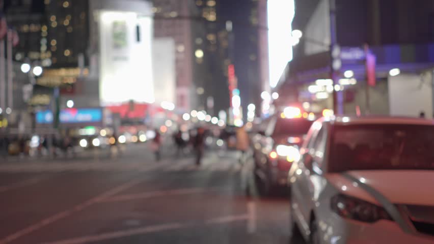 A Young Woman Navigates City Streets with her Smart Phone