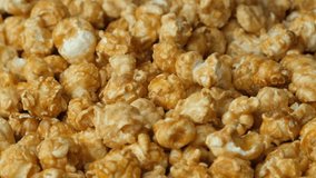 Caramelized sweet popcorn pours and spins, slow motion - Powered by Shutterstock - Get 15% off with code: PIKWIZARD15