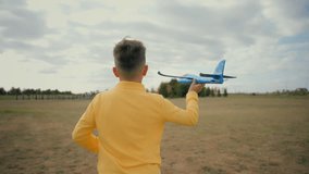 Happy excited cute Caucasian little boy kid child son running run farmland field holding toy play plane airplane playing launching looking sky say wow dreaming traveling pilot enjoy holidays outside - Powered by Shutterstock - Get 15% off with code: PIKWIZARD15