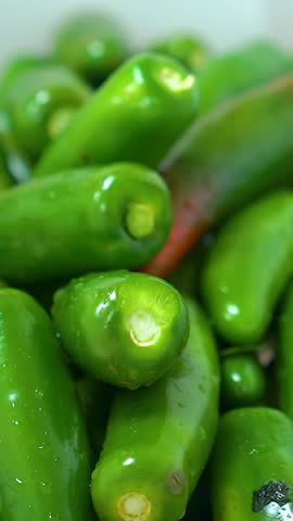 Making red chili and green jalapeno sauce. Hot jalapeno chili sauce. Making jalapeno sauce. Vertical video.