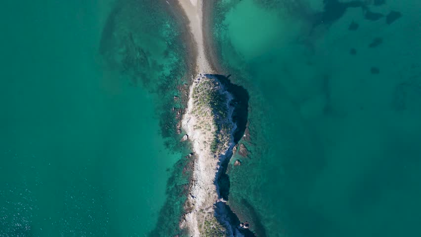 Aerial zenithal view of an archipelago of desert rocks covered with sahuaros in the sea of San Carlos, Sonora.