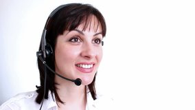 Telephone customer service ;  Beautiful young woman working in a telephone customer service,video clip