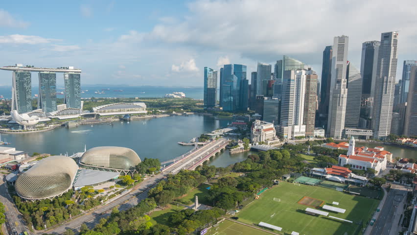 4k time lapse from sunset to sunrise scene (day to night to day) at Singapore Marina Bay city skyline. Pan left