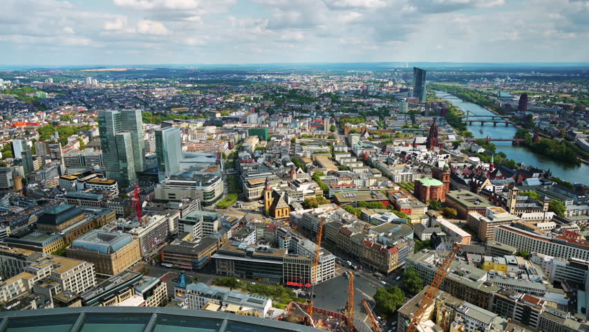 Panoramic view of Frankfurt from a skyscraper, Germany. Multiple residential and office buildings, skyscrapers, river Main