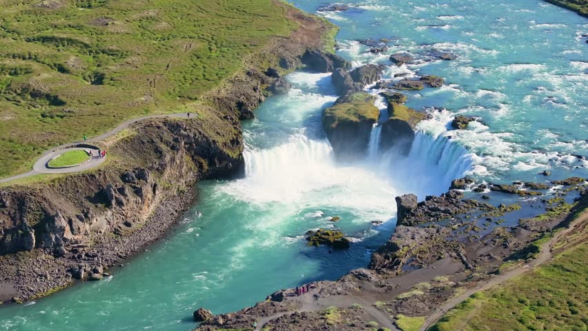 Aerial view of the majestic Godafoss waterfall cascading into a serene gorge, Nordurland Eystra, Iceland.
