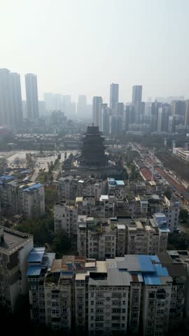 Aerial view of bustling cityscape with traditional buildings and modern skyscrapers, Wuhan, China.