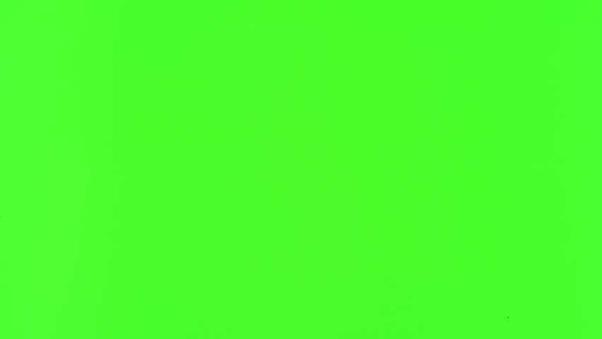 Super slow motion of gunshot through the glass, shattering against green screen background . Filmed on high speed cinema camera, 1000 fps.