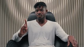 Serious confident African American ethnic man male guy gamer modern futuristic white room indoors cyberspace looking at camera technology vr shaking finger no gesture forbidden not never refuse deny - Powered by Shutterstock - Get 15% off with code: PIKWIZARD15