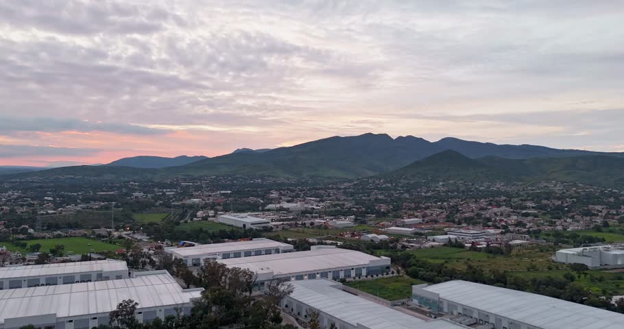 Drone hyperlapse capturing the transition from sunset to nighttime landscape in the area near the Sierra of Tepotzotlán, featuring towns from the municipalities of Cuautitlán Izcalli and Tepotzotlán