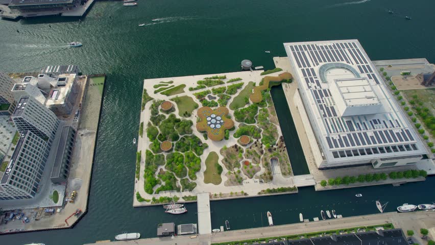 Aerial view of operapark with beautiful architecture and vibrant greenery by the canal, copenhagen, denmark.
