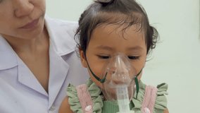 doctor applying medicine inhalation treatment on a toddler baby girl. child with a nebulizer mask at hospital - Powered by Shutterstock - Get 15% off with code: PIKWIZARD15