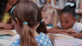 Animation of school items icons over diverse schoolchildren learning in classroom. Global education and digital interface concept, digitally generated video. - Powered by Shutterstock - Get 15% off with code: PIKWIZARD15