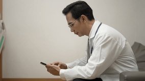 Doctor play mobile phone at hospital. Health care, technology. - Powered by Shutterstock - Get 15% off with code: PIKWIZARD15