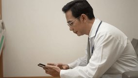 Doctor play mobile phone at hospital. Health care, technology. - Powered by Shutterstock - Get 15% off with code: PIKWIZARD15