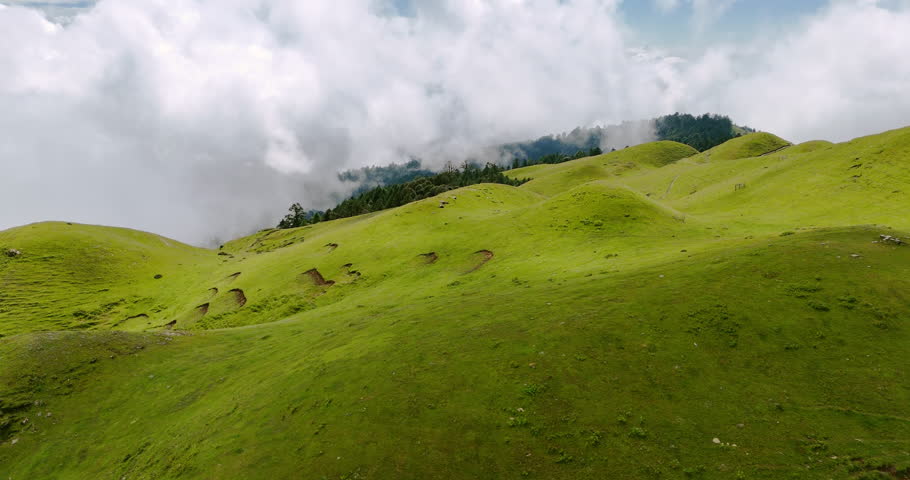 Aerial view captures lush greenery of hills forests Nepal mountain landscapes in Shailung Dolakha protected environment offers adventure scenic beauty under clear blue sky Earth’s natural wonders