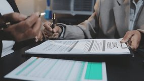 Real estate agent talked about the terms of the home purchase agreement and asked the customer to sign the documents to make the contract legally, Home sales and home insurance concept. - Powered by Shutterstock - Get 15% off with code: PIKWIZARD15