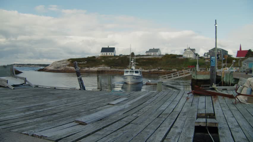 A Stunning Cinematic Shot Colorful Wooden Fishing Cabins And Boats In Peggy