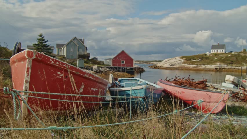 A Beautiful Cinematic Shot Of The Colorful Wooden Cabins And Fishing Boats That Populate Peggy