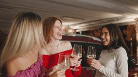 Three Joyful Friends Celebrate a New Car Purchase, Clinking Glasses and Drinking Champagne for a Fun and Memorable Moment - Powered by Shutterstock - Get 15% off with code: PIKWIZARD15
