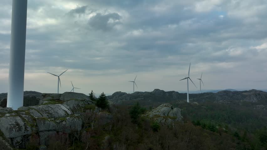 Norwegian wind farm produces eco-friendly power in natural coastal setting.