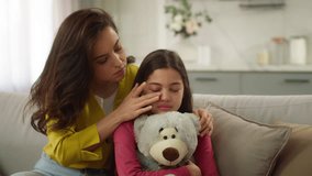 Worried Caucasian parent woman feel guilty female mother apologizing ask forgiveness little girl after quarrel argument calming sad child hugging saying sorry to crying kid daughter indoor living room - Powered by Shutterstock - Get 15% off with code: PIKWIZARD15