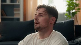 Smiling proud tired exhausted Caucasian man male guy sportsman athlete wipes forehead sweat difficult workout hard exercise training sport fitness relaxing friendly looking camera indoors living room - Powered by Shutterstock - Get 15% off with code: PIKWIZARD15