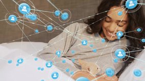 Animation of network of connected icons in circles over happy biracial woman petting pet cat. Connection, communication, animal, pet and expression concept digitally generated video. - Powered by Shutterstock - Get 15% off with code: PIKWIZARD15