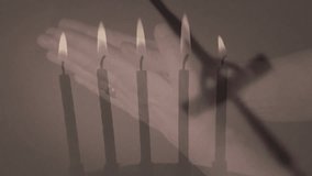 Animation of rosary and burning candles over hands parying. Faith and religion concept digitally generated video. - Powered by Shutterstock - Get 15% off with code: PIKWIZARD15