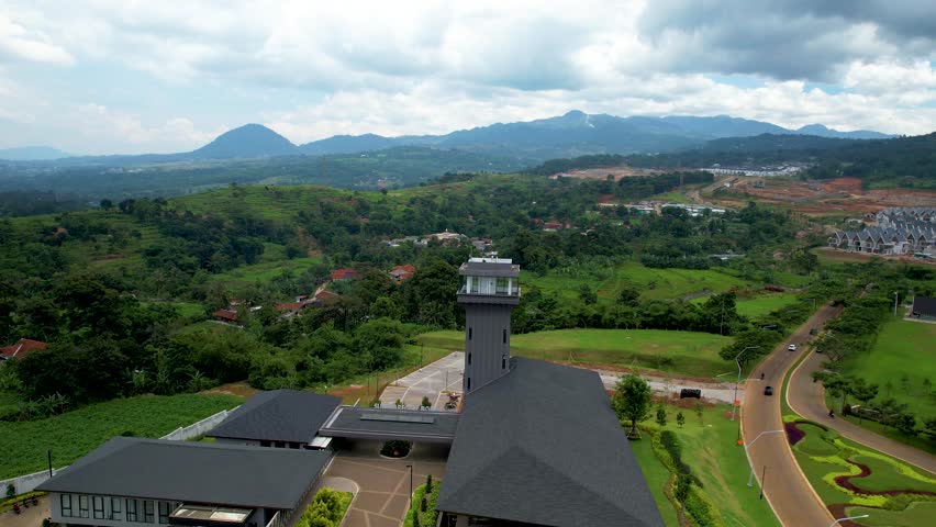 Aerial View of the Tower in Hilly Landscape